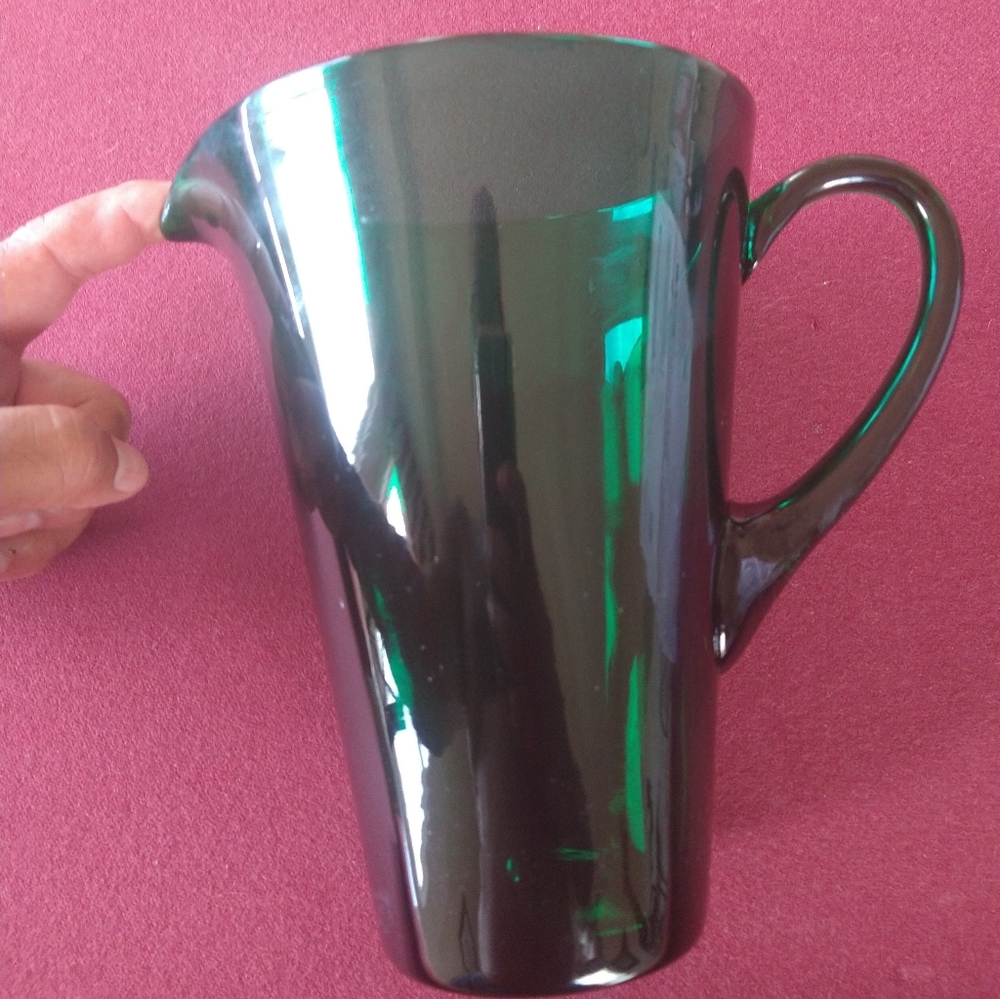 Vintage forest green glass pitcher.